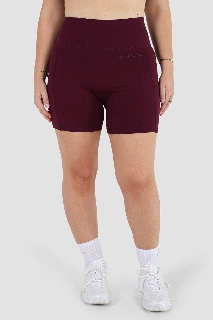 FORM FLOW POCKET SHORT PLUM - Fayt The Label